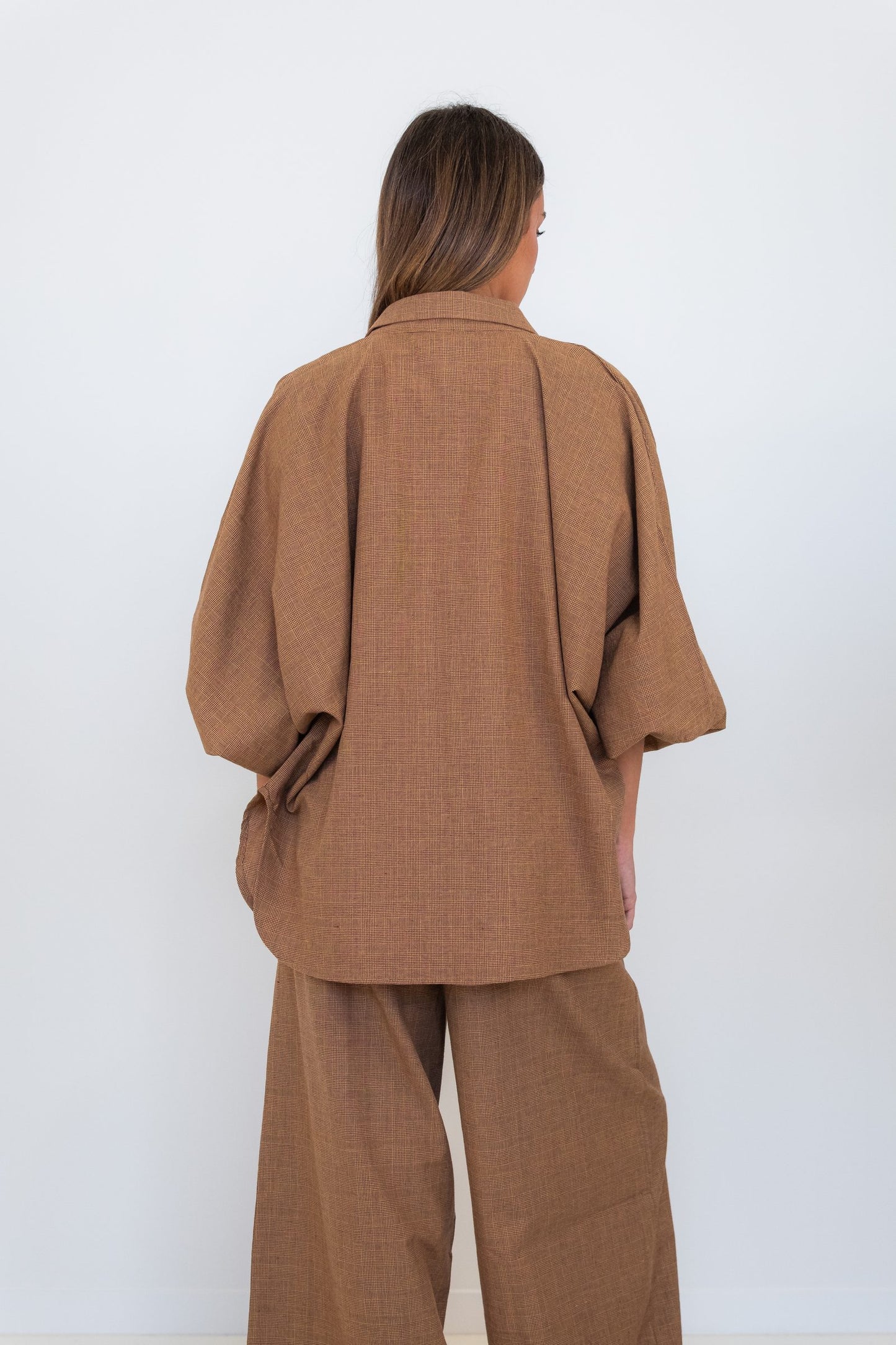 Back view of the Chocolate Prince of Wales Butterfly Shirt, showing its relaxed oversized silhouette and check pattern.