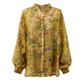Yellow patterned blouse on a white background