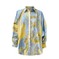 Blue and yellow patterned shirt on a light gray background