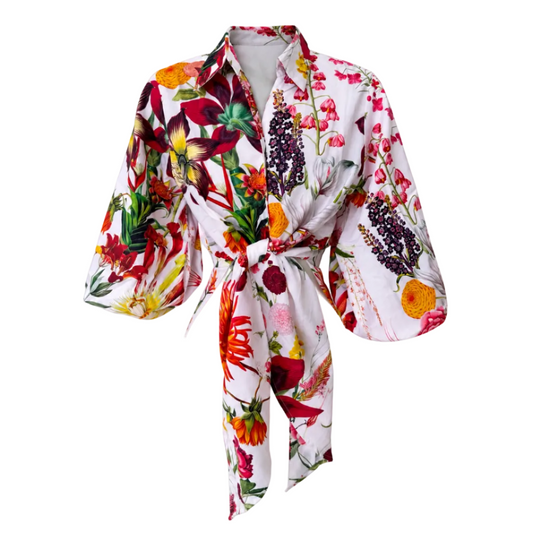 A white kimono-style robe with a vibrant, multicolored floral and botanical print, featuring wide three-quarter sleeves and a self-tie belt, shown against a plain white background.