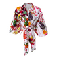 A white kimono-style robe with a vibrant, multicolored floral and botanical print, featuring wide three-quarter sleeves and a self-tie belt, shown against a plain white background.