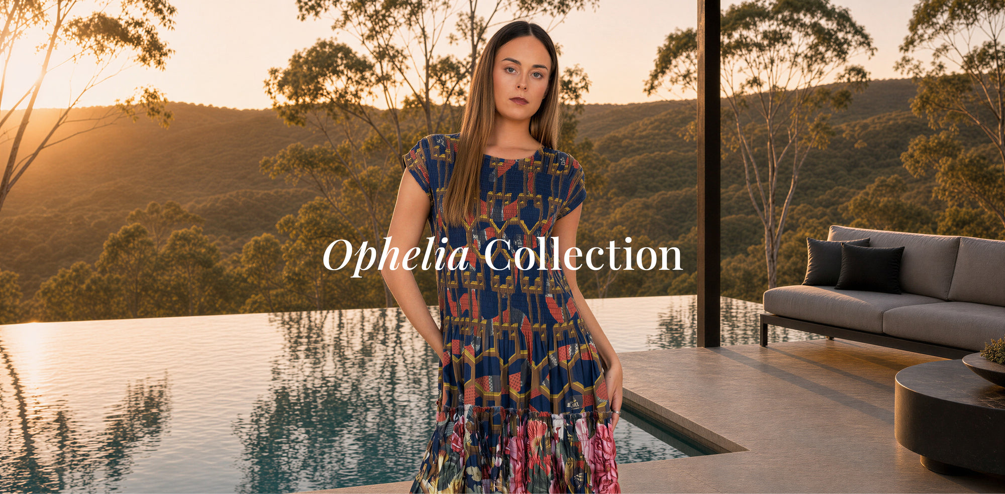 A woman wearing a colorful patterned dress stands by an infinity pool at sunset, with hills and trees in the background and a sofa on the right. The text 'Ophelia Collection' is overlaid across the center.