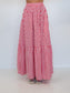 A red and white gingham tiered maxi skirt shown on a model from the waist down, featuring an elastic waistband and two gathered tiers, set against a plain white background.