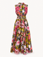 A sleeveless, high-neck, floor-length A-line dress with a vibrant floral print. The dress features a structured bodice, a matching self-tie waist belt, and a full skirt.
