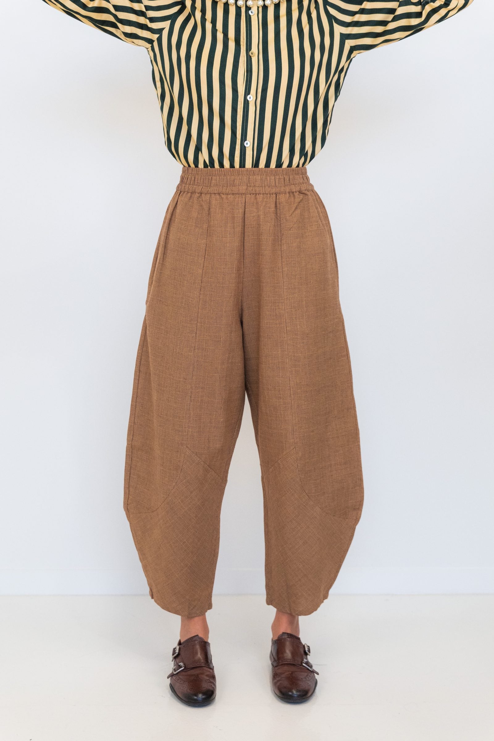 Front view of Chocolate Prince of Wales barrel pants showing the brown check fabric and tapered barrel shape.