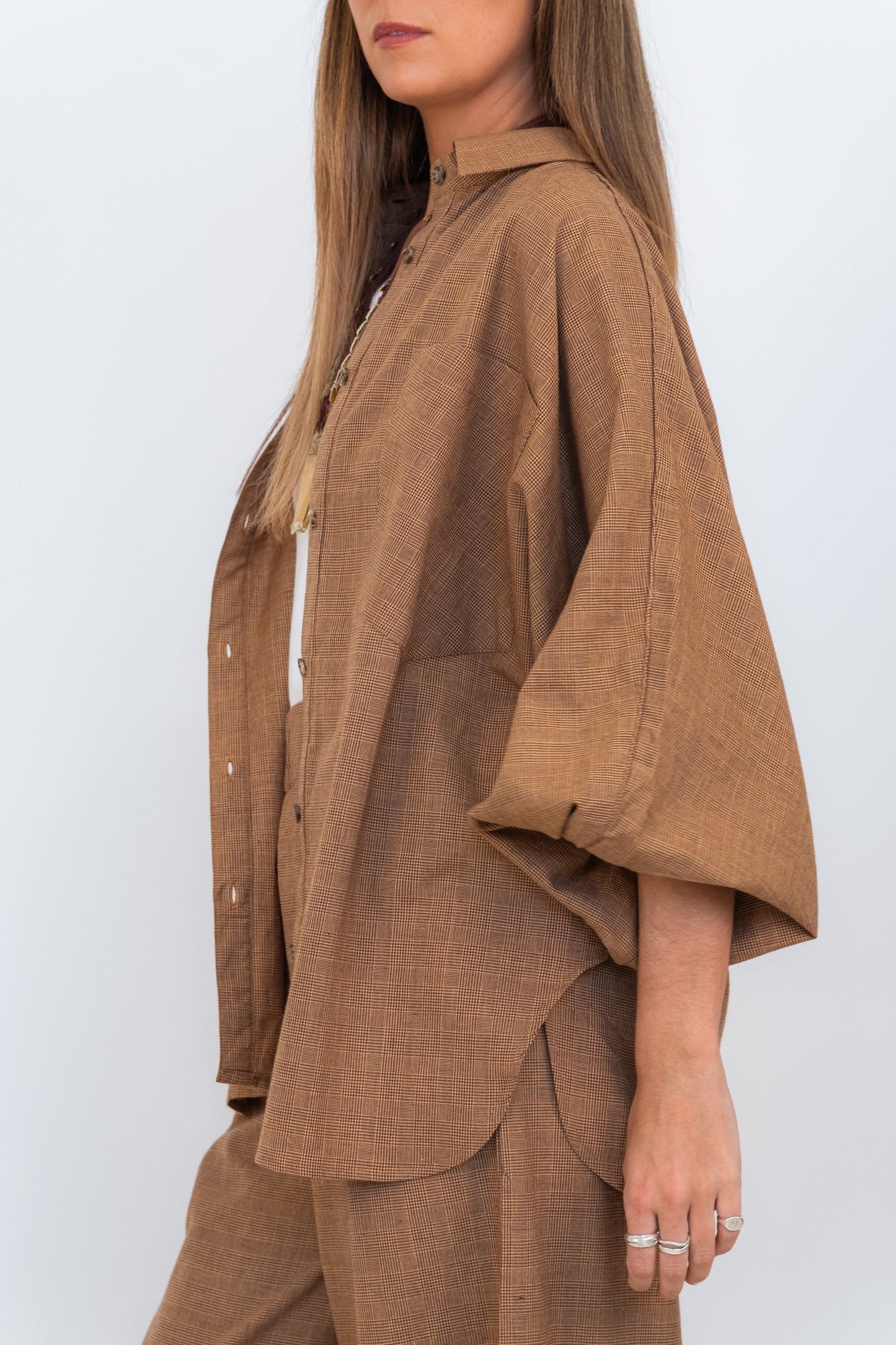 Side view of the Chocolate Prince of Wales Butterfly Shirt, showing the relaxed oversized fit and butterfly sleeve.