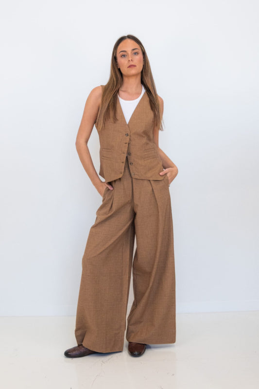 Full-length model wearing the Chocolate Prince of Wales Vest with matching wide-leg check trousers.