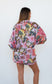 Back view of the Ophelia Pink Butterfly Shirt, showing the relaxed oversized fit and pink floral print.