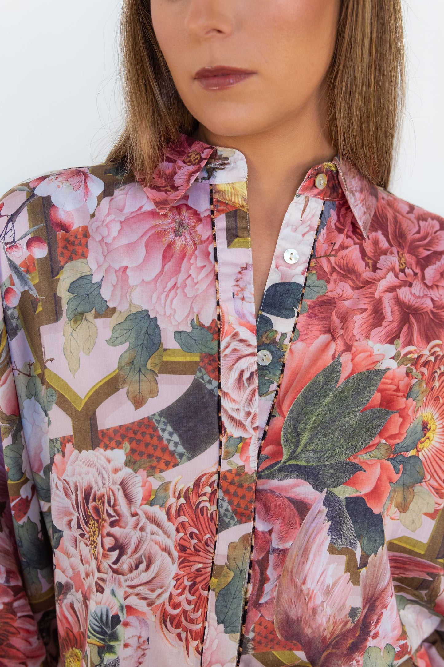 Close-up of the classic collar, button-through front, and floral print on the Ophelia Pink Butterfly Shirt.