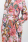 Close-up of the pocket detail and collared neckline and pink floral-and-chain print on the Ophelia drop-waist dress.