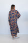 Back view of the Ophelia Snakes Butterfly Dress, showing its loose drape and geometric print.