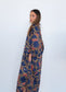 Side view of a model wearing the Ophelia Snakes Butterfly Dress with loose butterfly sleeves.