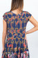 Close-up back view of the smocked bodice on the Ophelia snakes and florals maxi dress.