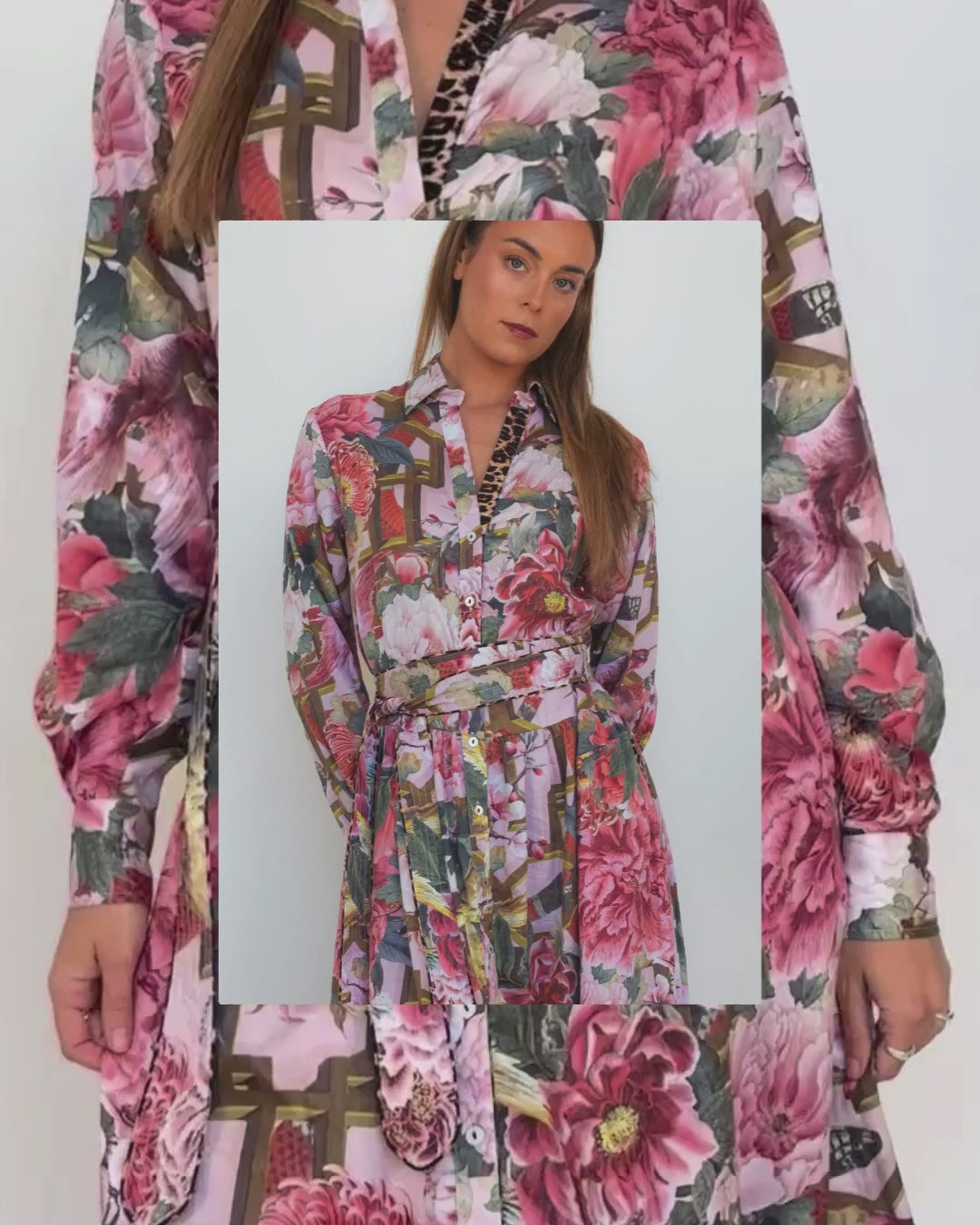 Model wearing the Ophelia pink floral-and-chain print drop-waist dress with a slim tie belt and close-up of fabric details .