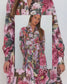 Model wearing the Ophelia pink floral-and-chain print drop-waist dress with a slim tie belt and close-up of fabric details .